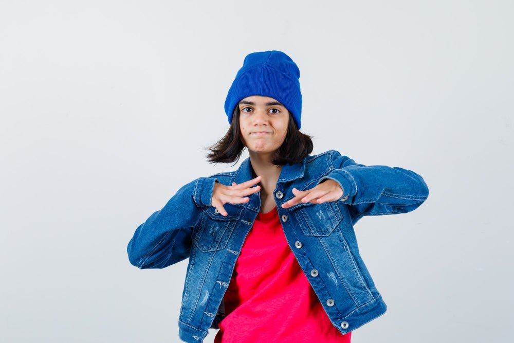 a girl worn a beanie and giving expression