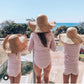 cute straw hat showing same hat on both mother and daughter 