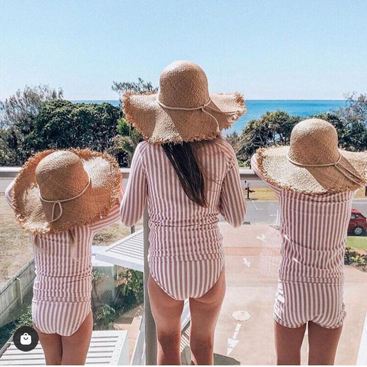 cute straw hat showing same hat on both mother and daughter 