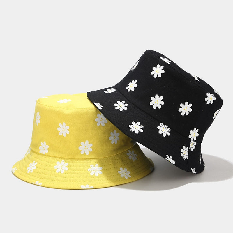 flower bucket hat showing black and yellow hats stacked
