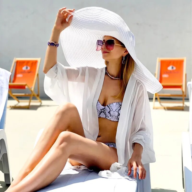 Large sun hat on model in white color