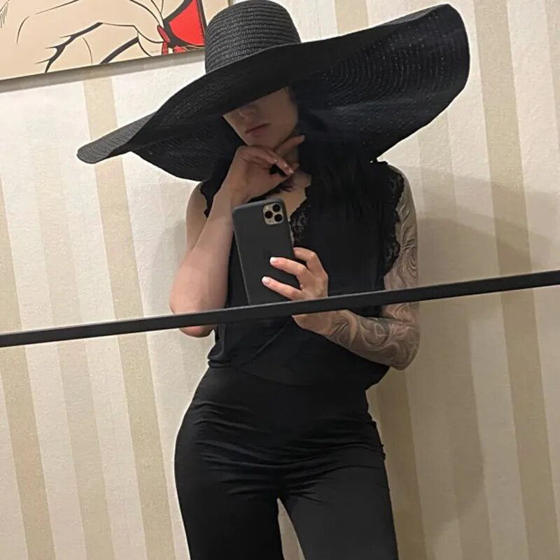 Large sun hat on model in black color