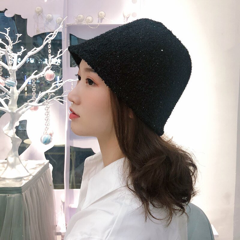 Fuzzy Bucket Hat on model in black side view 