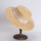 flat straw hat on stand with 3 inch brim