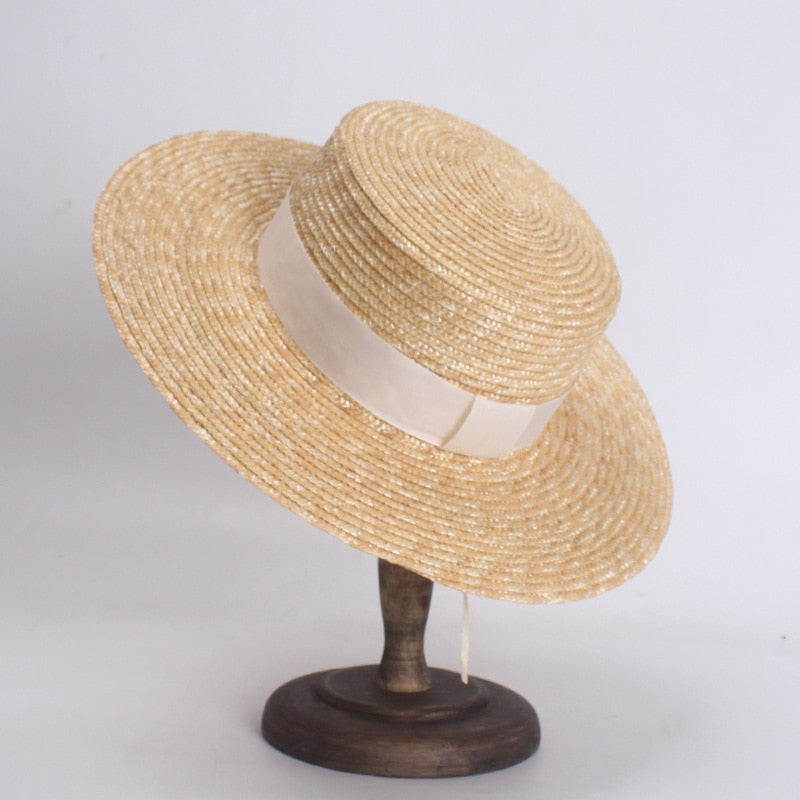 flat straw hat on stand with 3 inch brim