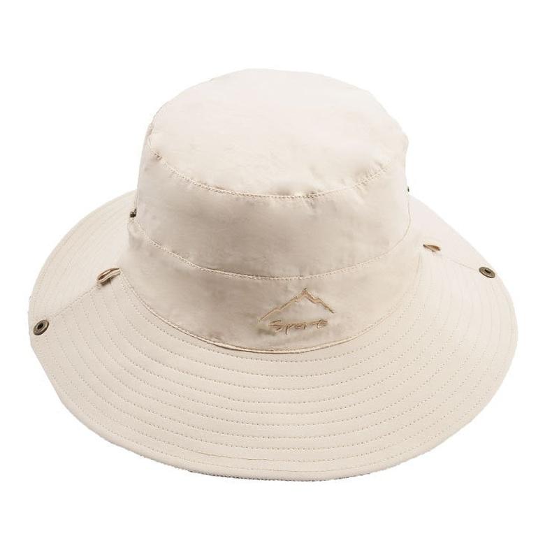 reversible bucket hat showing beige solid color side