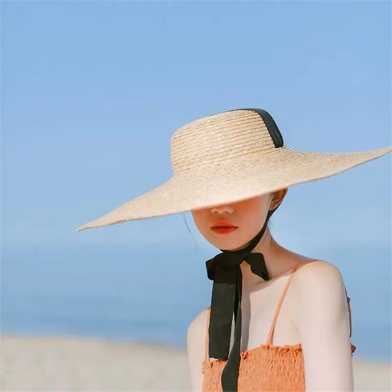 ribbon hat on model showing side view 