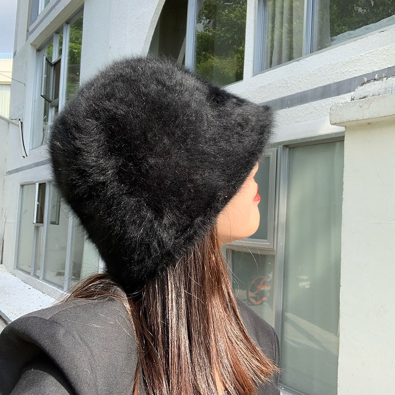 fur bucket hat on model in black back view 