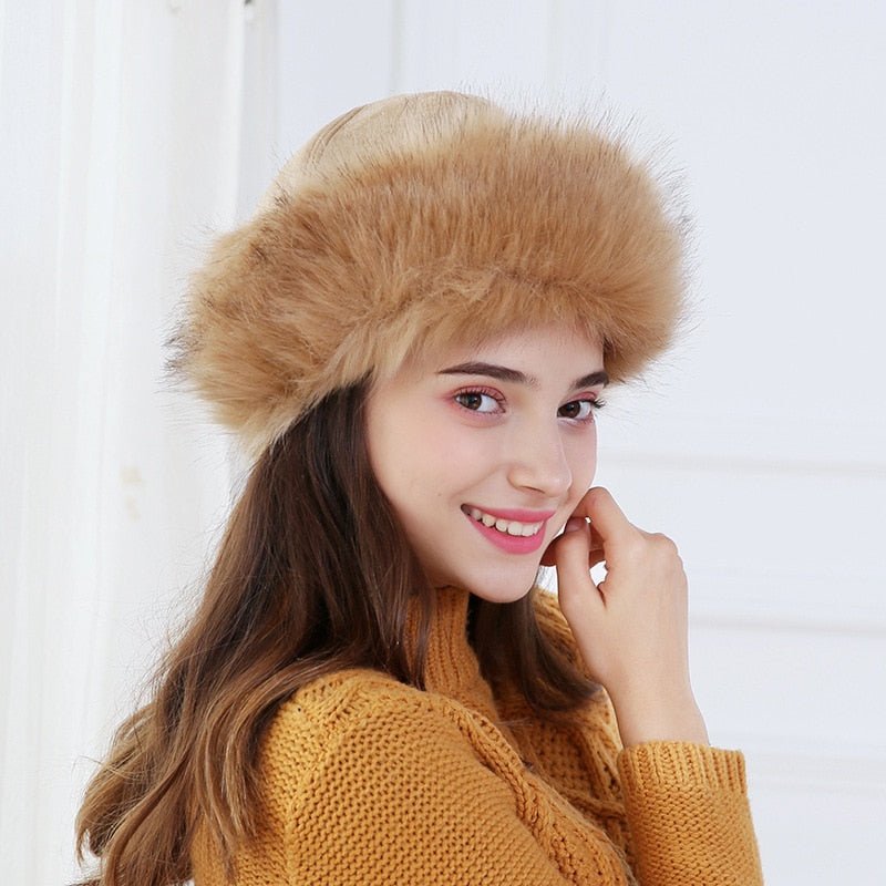 ushanka hat on model in tan showing side view 