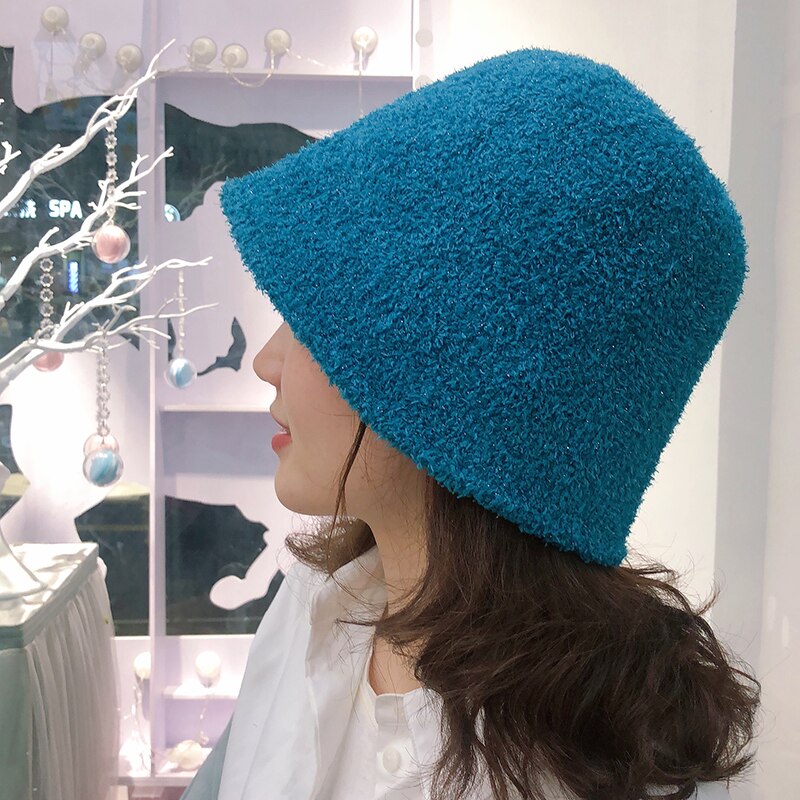 Fuzzy Bucket Hat on model in blue side view