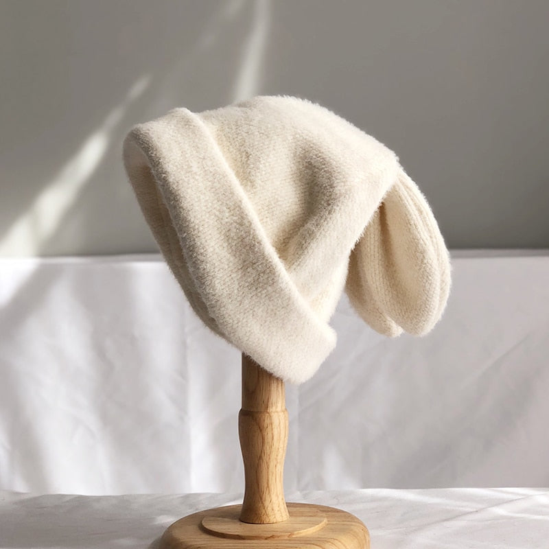 bunny ear beanie in white on stand