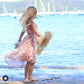 cute straw hat full view of a model at the beach