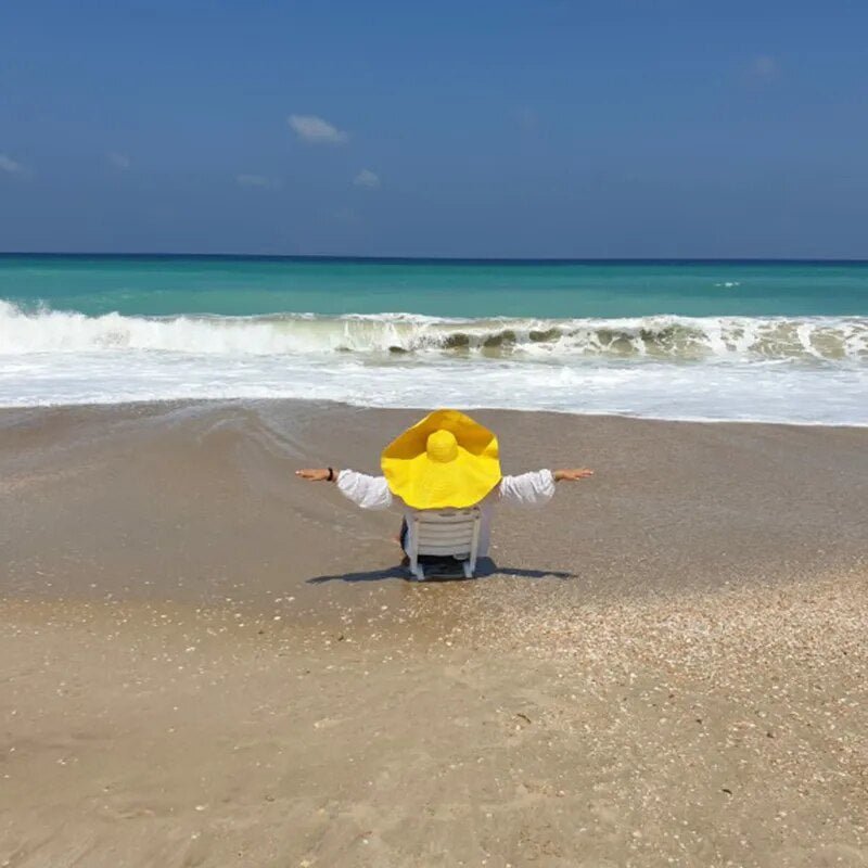 Large sun hat on model in yellow color