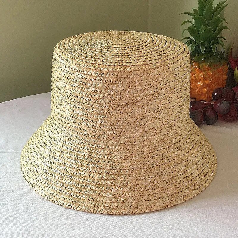 straw bucket hat showing a no ribbon verison of that hat 