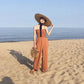 ribbon hat staw sun hat on model at beach full body view 