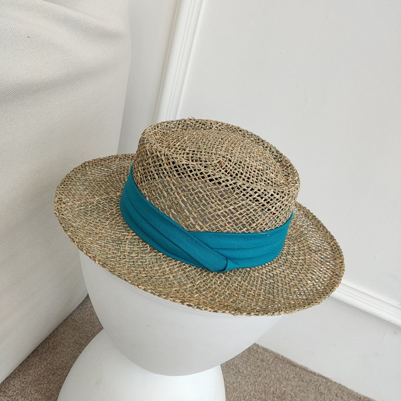 straw fedora hat showing turquoise ribbon