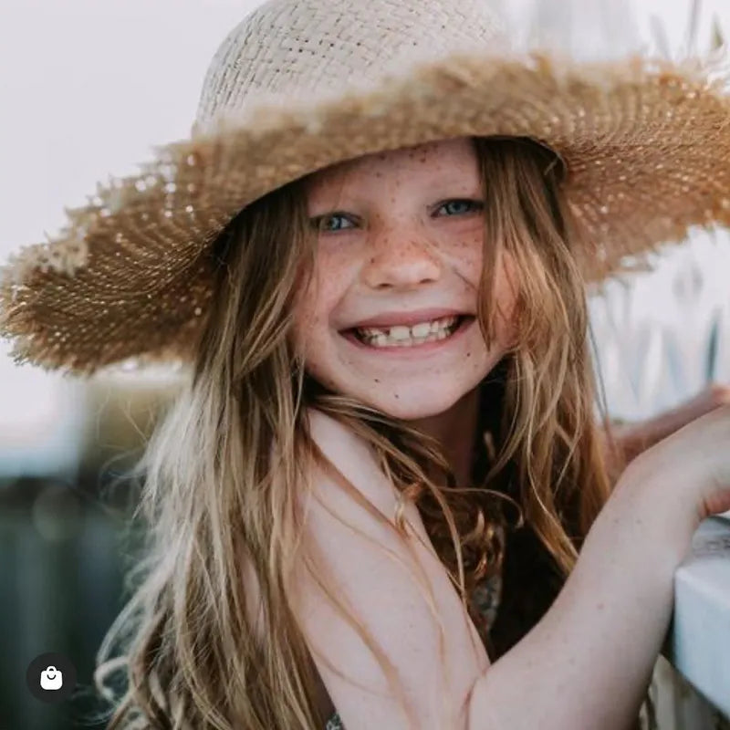 cute straw hat on a child model closeup 