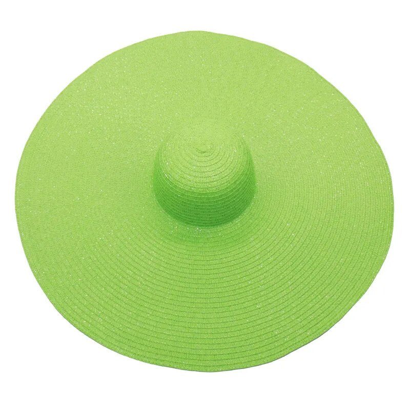 Large sun hat laying flat in gren