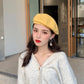 french barrette hat on model yellow