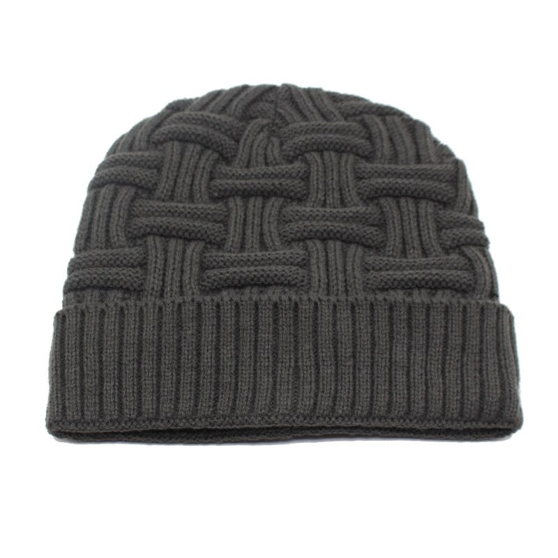rib knit hat showing beanie laying flat on white background