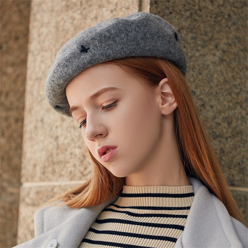 french beret hat on model in gray side view 