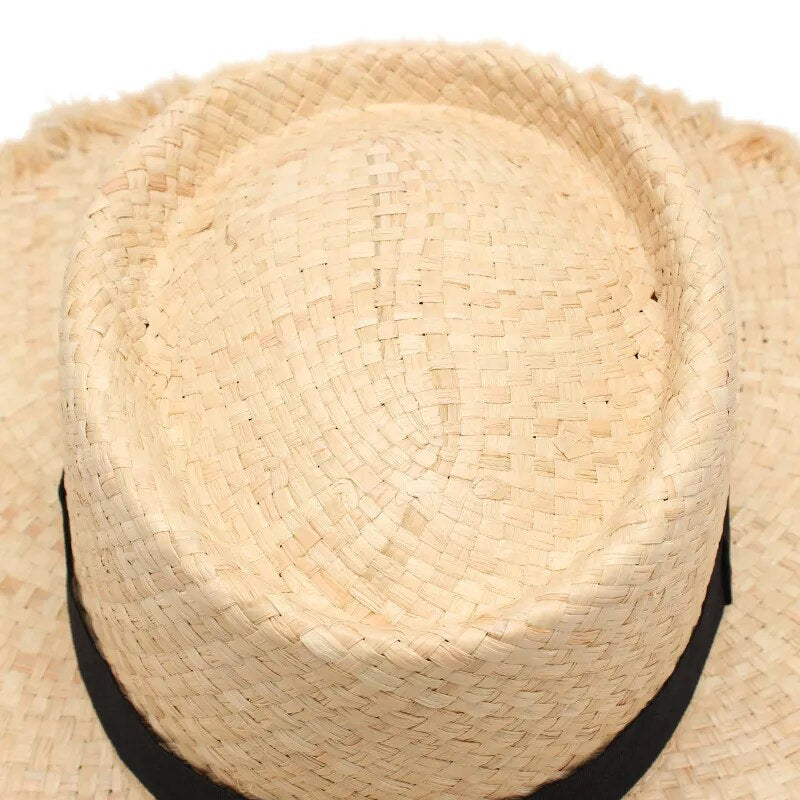fringe straw hat closeup of top of hat 