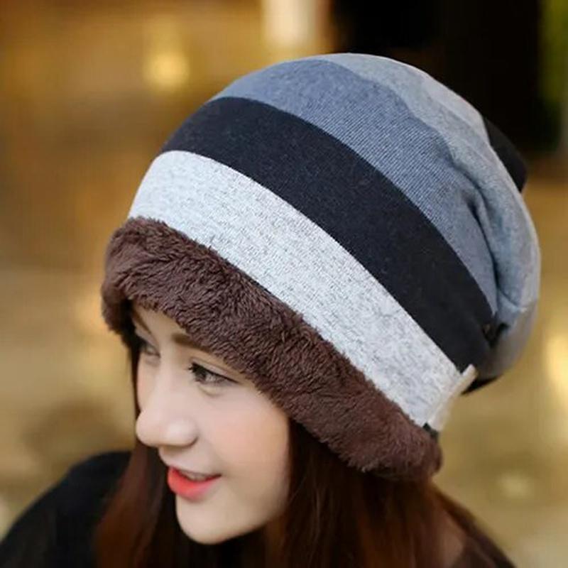 Stripped Beanie on model side view with grey and black 