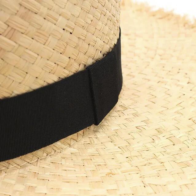 fringe straw hat close up of raffia straw 