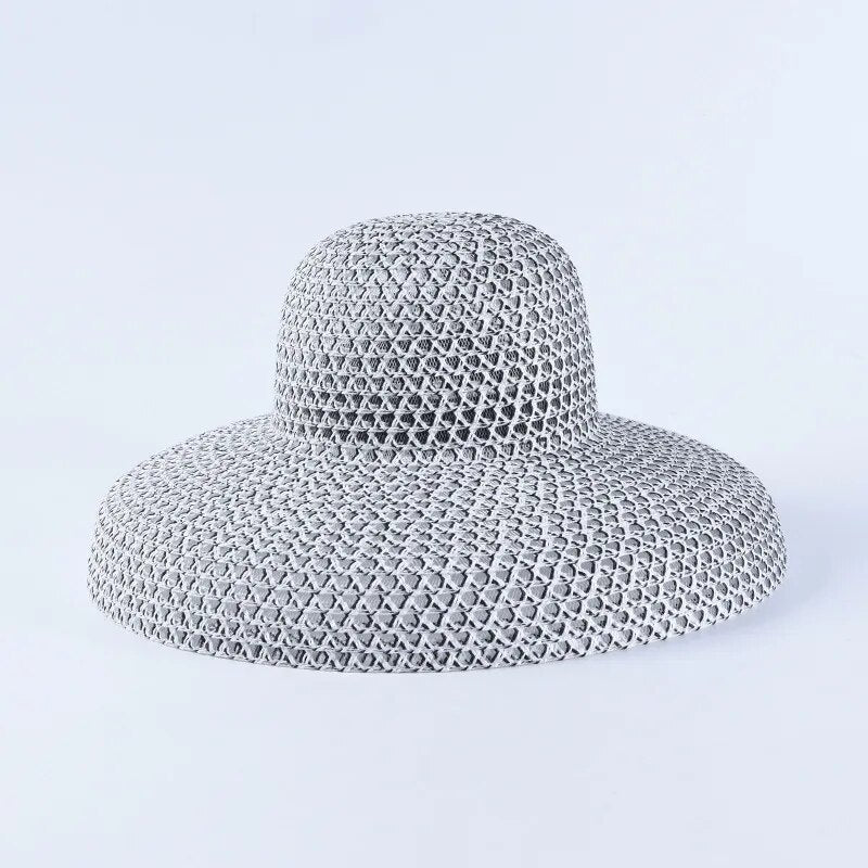 wide brimmed sun hat in gray on solid background 