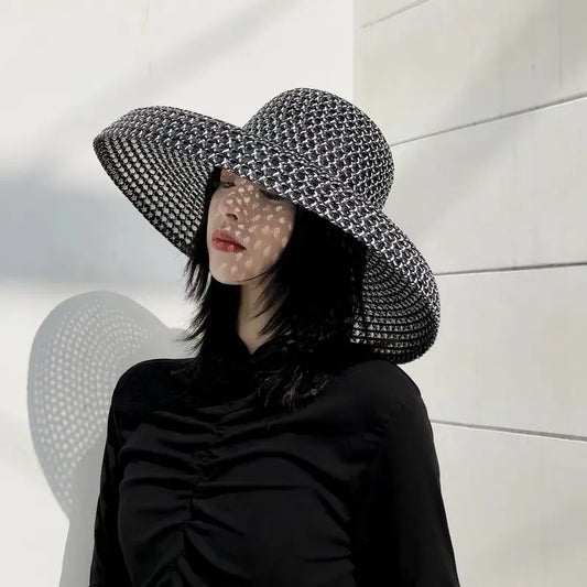 wide brimmed sun hat in black on model front view 