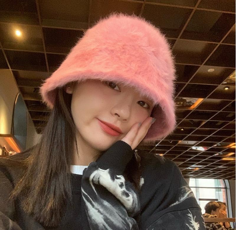 fur bucket hat on model in pink