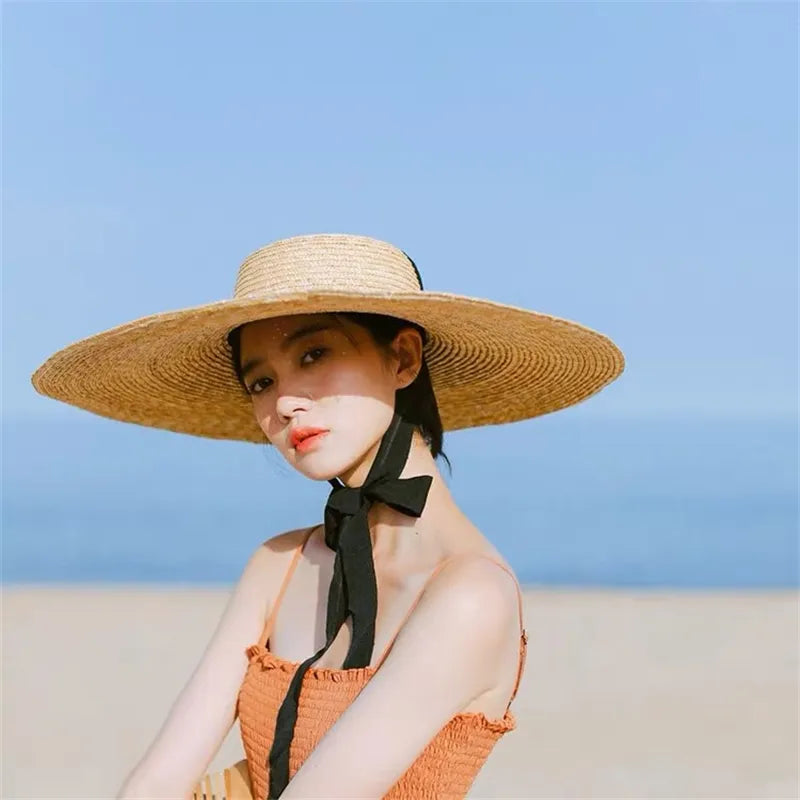 ribbon hat on model at beach