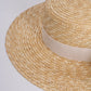 flat straw hat showing closeup of brim
