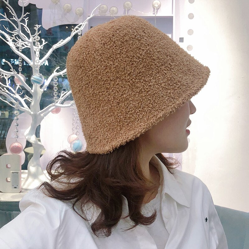 Fuzzy Bucket Hat on model in tan side view
