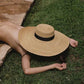 Wide Brim Hat on a model taking a nap with the hat on