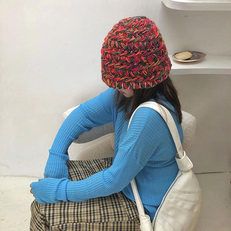 Knitted Bucket Hat on a model who is sitting