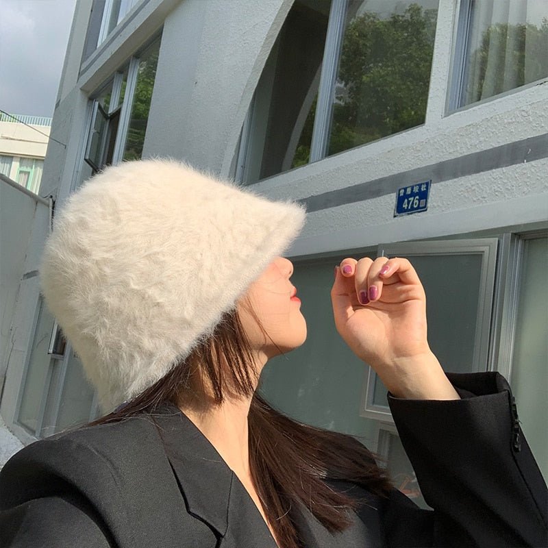 fur bucket hat on model in beige 