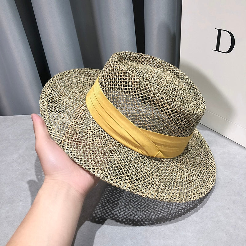 straw fedora hat showing yellow ribbon