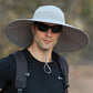 wide brim bucket hat on model in light gray