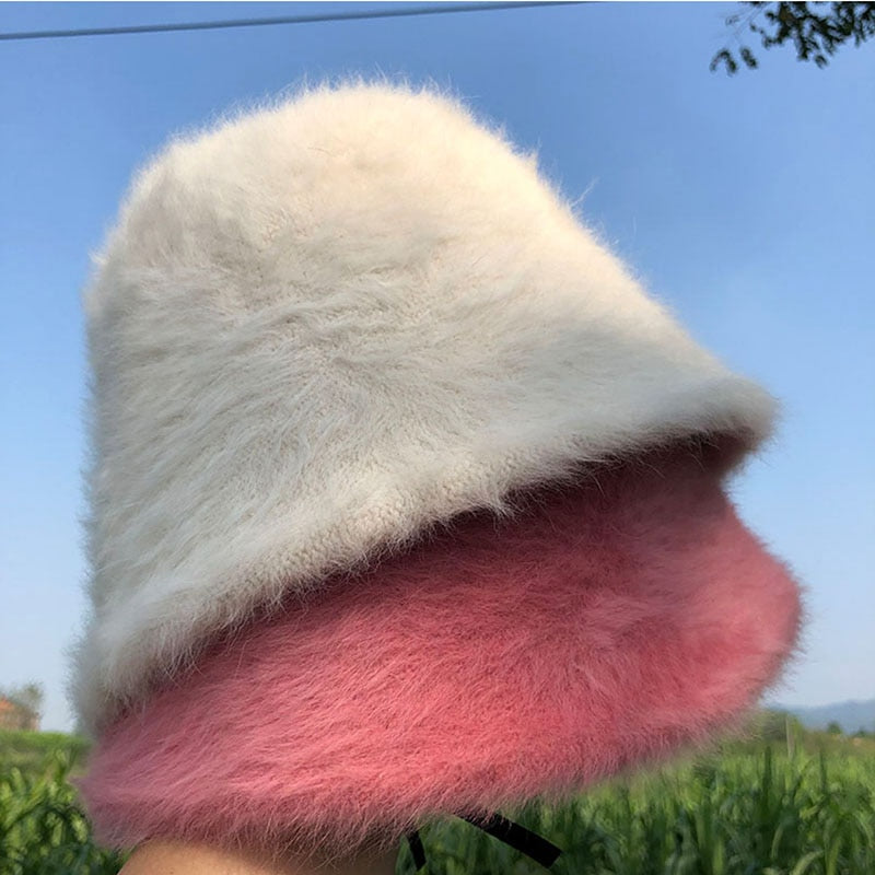 fur bucket hat showing beighe and pink hats