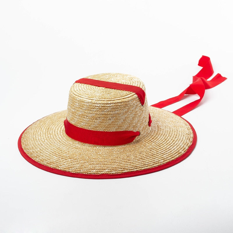 sun hat with tie with red ribbon