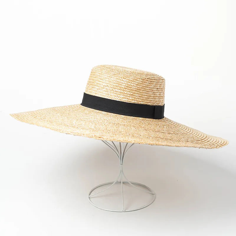 straw beach hat on stand showing side view of hat 