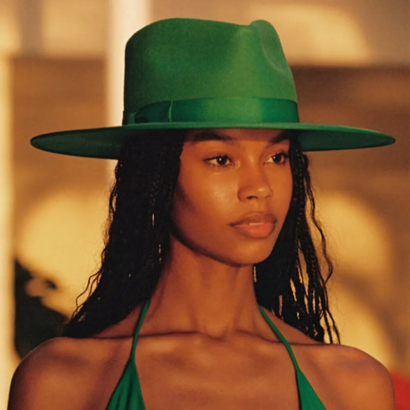fedora sun hat on model in green