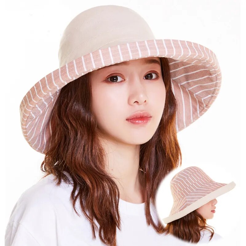 brimmed sun hat in beige on model showing front of hat 