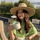 womens straw sun hat on model