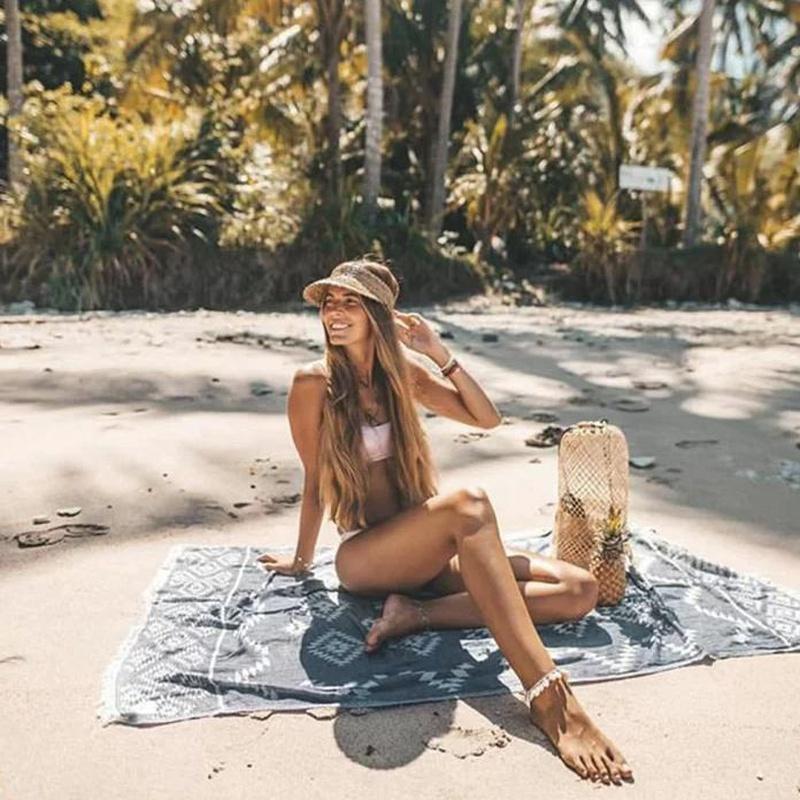 raffia visor on model at beach