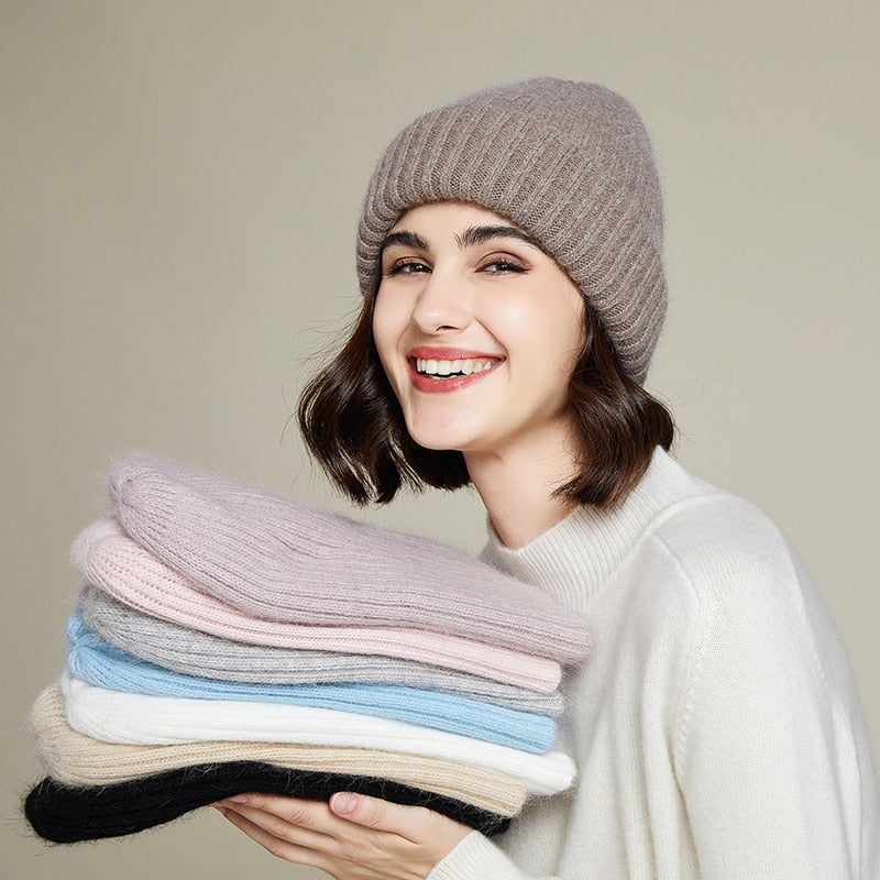 Plush Beanie on model holding other color options