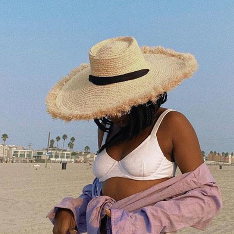 wide brim sun hat on model at beach