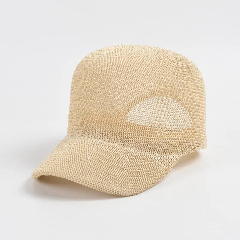 straw baseball cap in cream colors on white background 