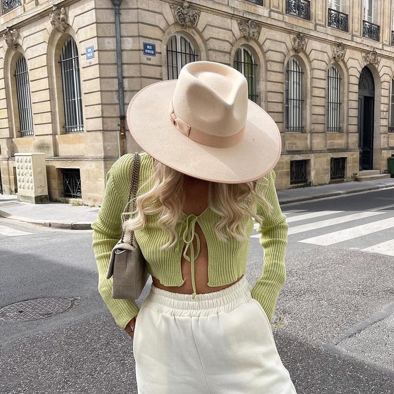 fedora cowboy hat on model in the street.